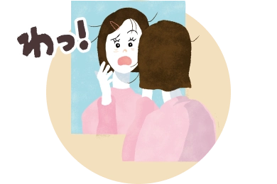 不意に鏡に映った自分にびっくりしているイラスト